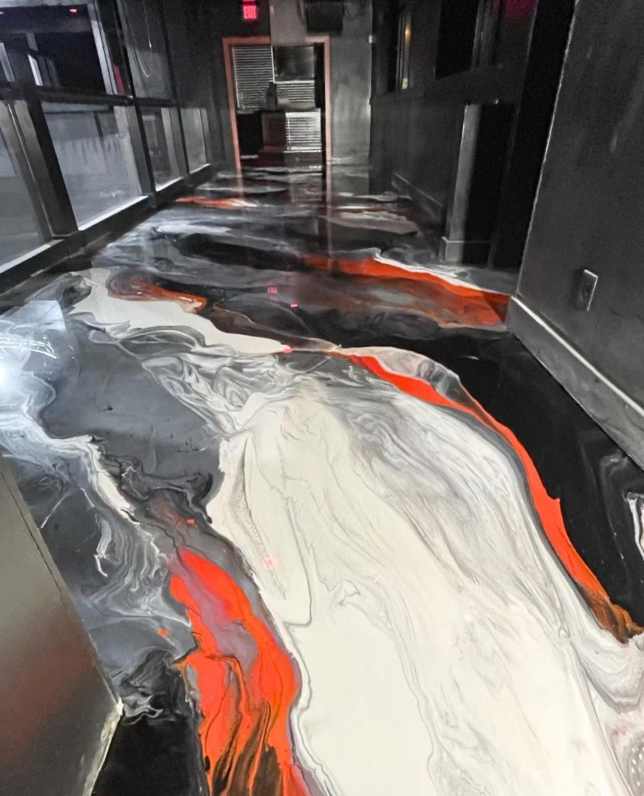 Metallic epoxy floor in black, white and red