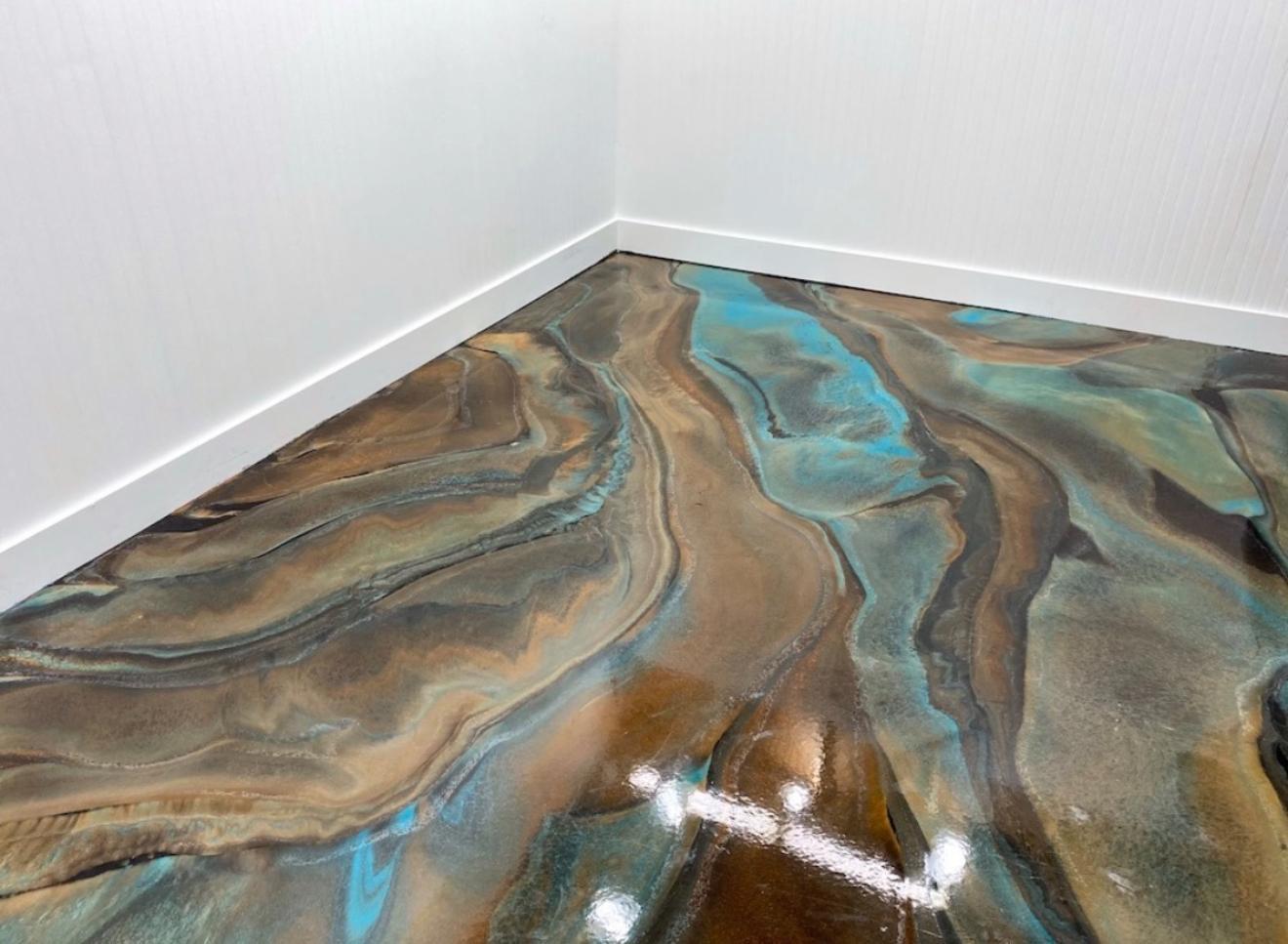 Metallic epoxy floor in teal, brown and gold