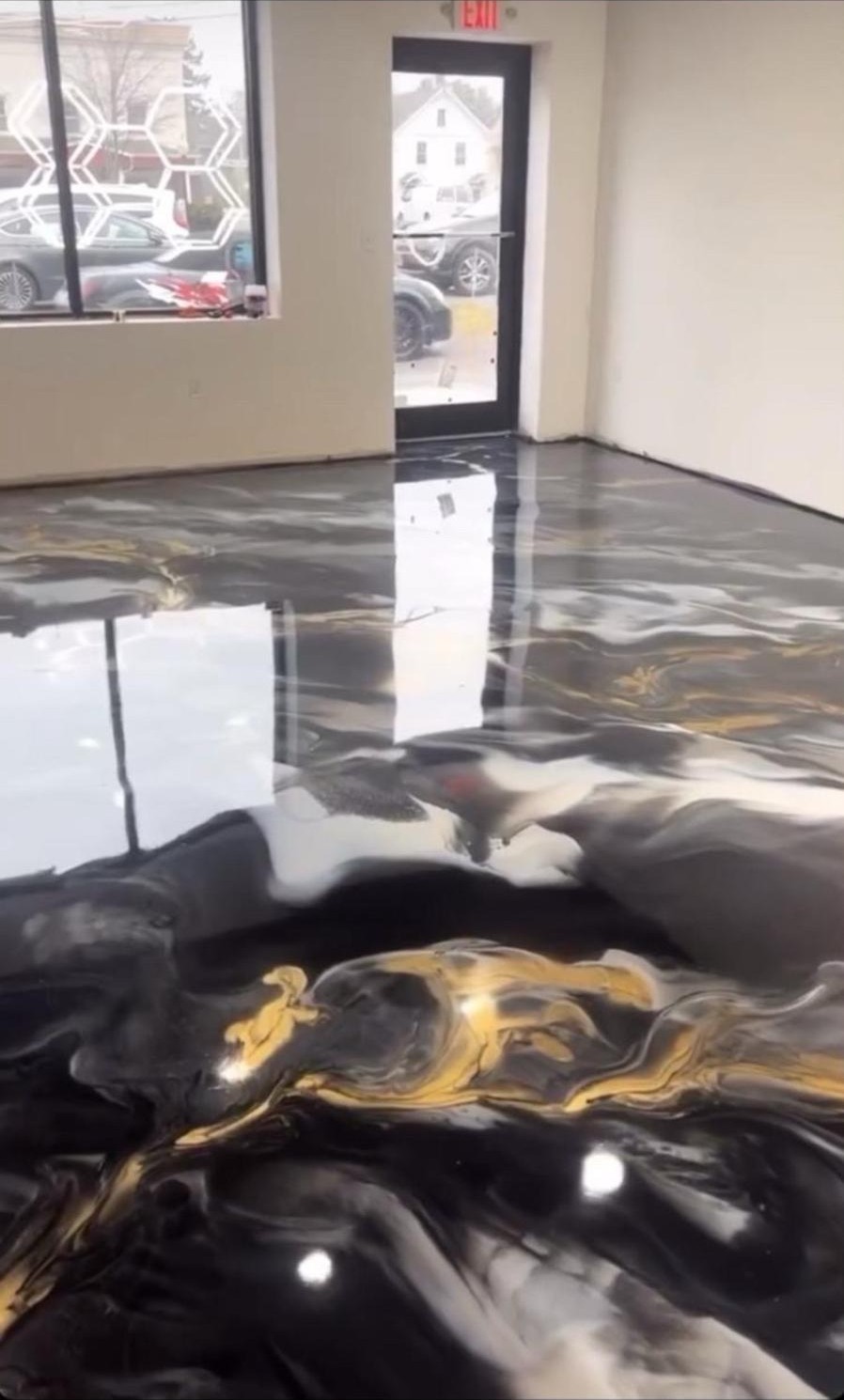 Black and gold metallic floor in a commercial space